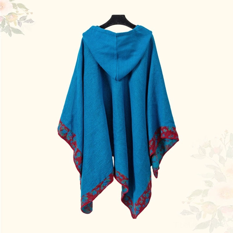 Tibetan prayer shawl worn as travel blanket on airplane or transportation, comfort feature photography