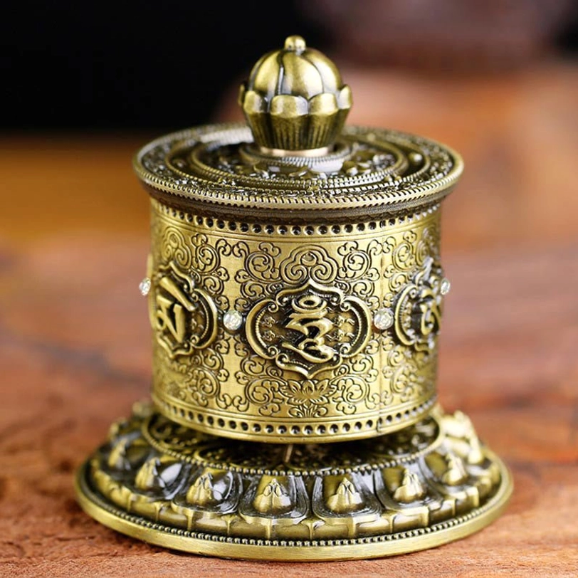 Tibetan prayer wheel car decoration bronze finish overhead view with lotus engraving and Om Mani Padme Hum mantra