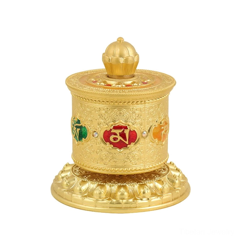 Gold Tibetan prayer wheel car decoration showing premium finish with lotus and mantra symbols