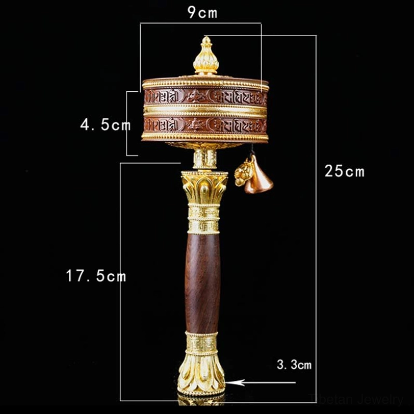 Tibetan prayer wheel held in hand demonstrating portable spiritual tool