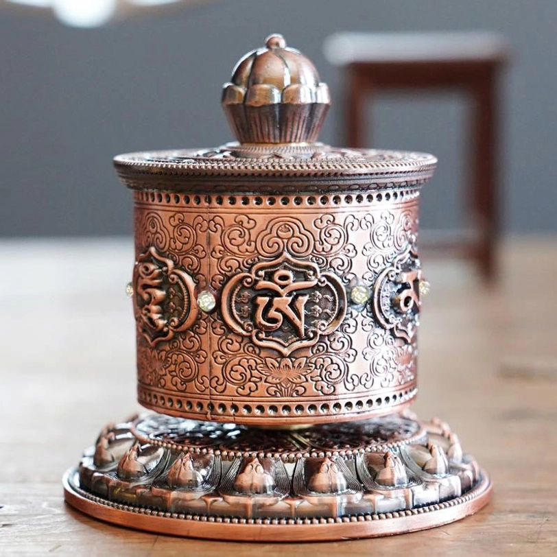 Tibetan prayer wheel handmade decoration showing authentic craftsmanship and sacred mantra carvings