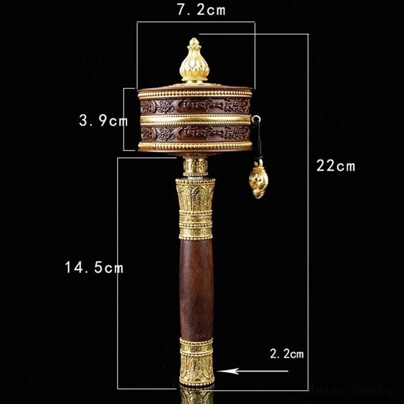 Prayer wheel close-up showing intricate gold accents and carved details