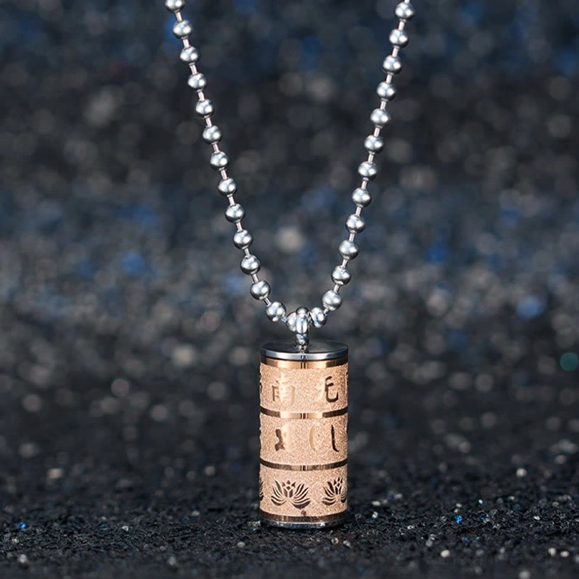 Tibetan prayer wheel pendant necklace lifestyle wearing shot spiritual meditation jewelry