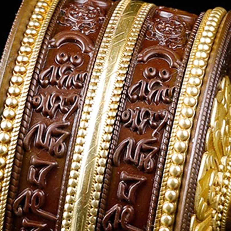 Tibetan copper prayer wheel with Om Mani Padme Hum mantra engraved design