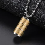 Om Mani Padme Hum titanium steel prayer wheel pendant necklace in dual-tone gold and silver with engraved lotus pattern