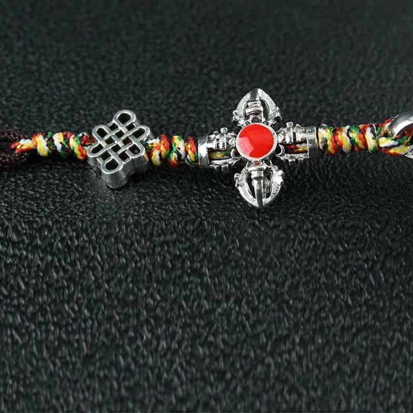 Tibetan prayer wheel car decoration featuring six-word mantra with handcrafted alloy body and gemstone accents for spiritual practice