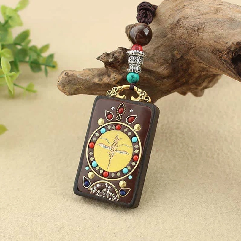 Tibetan prosperity thangka pendant necklace with sacred deity artwork and natural braided string closure