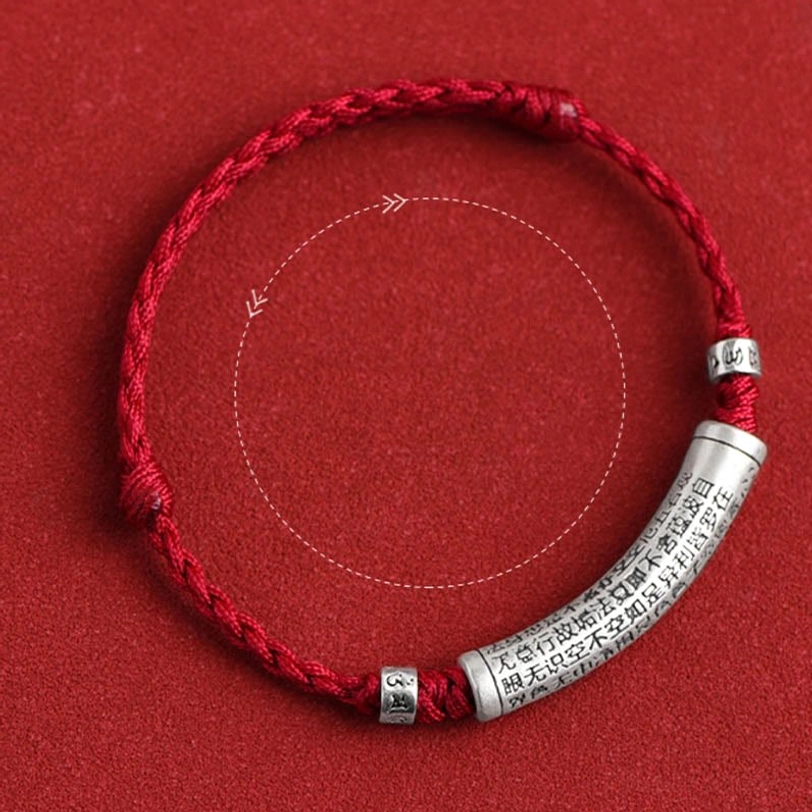 Adjustable braided red rope mantra bracelet with long engraved silver charm showing measurement guide and size reference