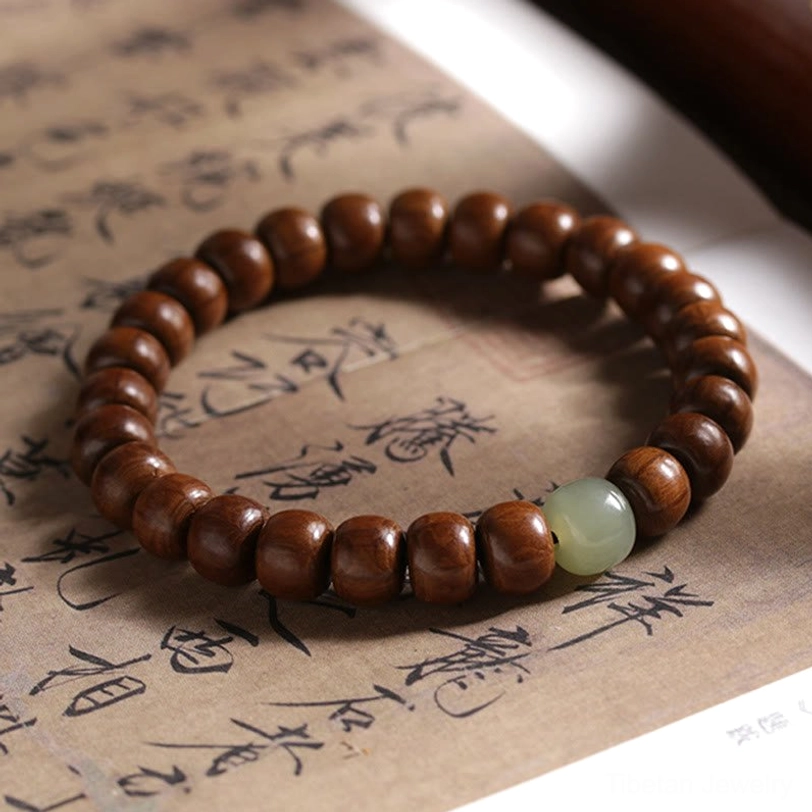 Tibetan Abelia Biflora wood and Hetian jade bracelet with 6x8mm beads and bamboo jade spacer detail