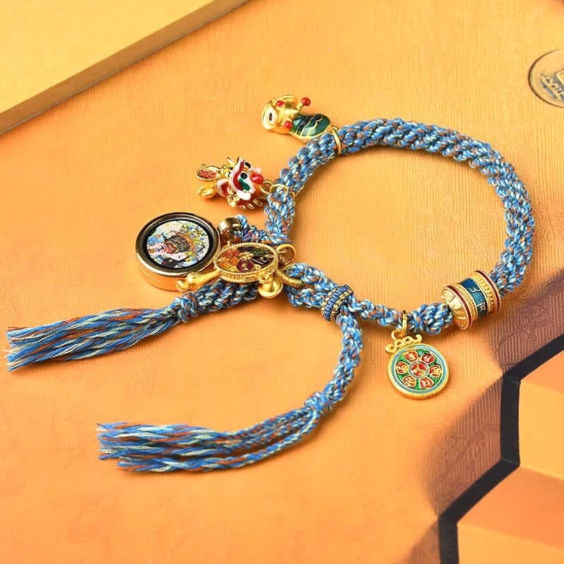 Handmade tibetan protection bracelet with double-sided tassels and metal charm accents