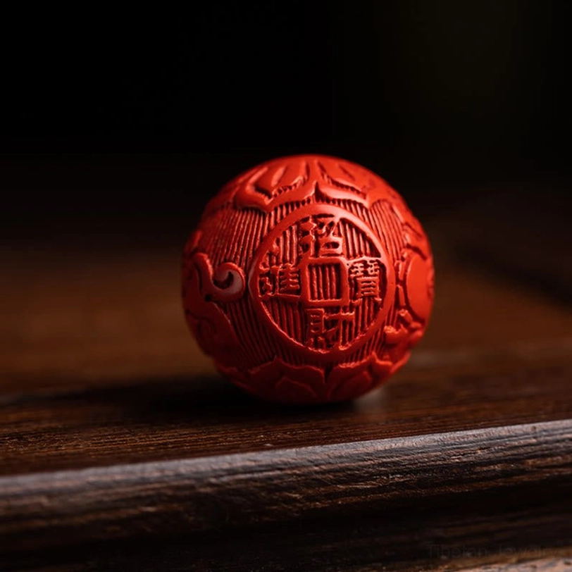 Tibetan protection keychain with red sandalwood beads and authentic cinnabar carving detail