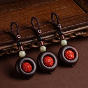 Tibetan Buddhist protective keychains with Om Mani Padme Hum carved cinnabar beads and red sandalwood flat lay arrangement