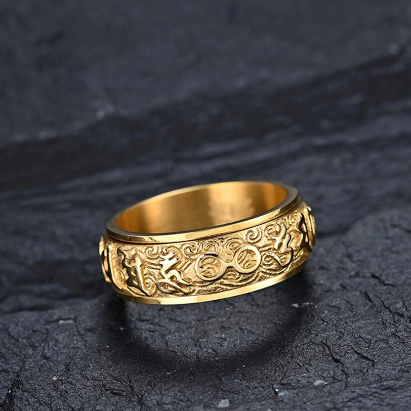 Tibetan Buddhist Om Mani Padme Hum spinner ring showing three-dimensional carving of protective symbols and Sanskrit characters