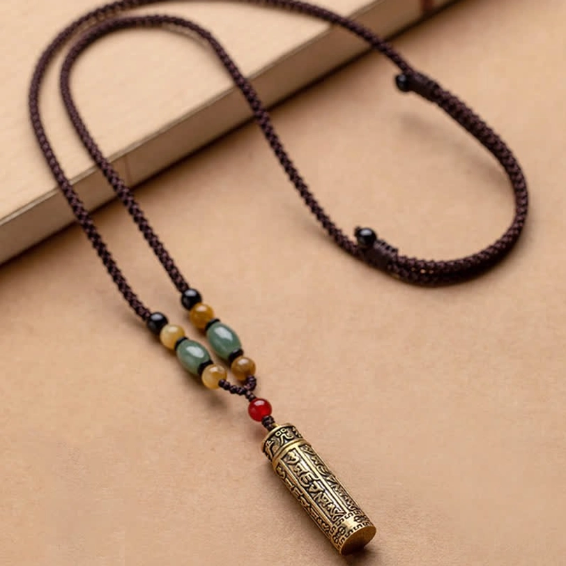 Tibetan Om Mani Padme Hum necklace with fine braided cord, mixed gemstone beads, and engraved brass cylinder pendant