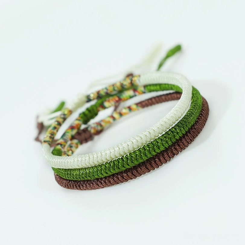 Complete Tibetan King Kong Knot three-bracelet set arranged showing all colors and woven knot details