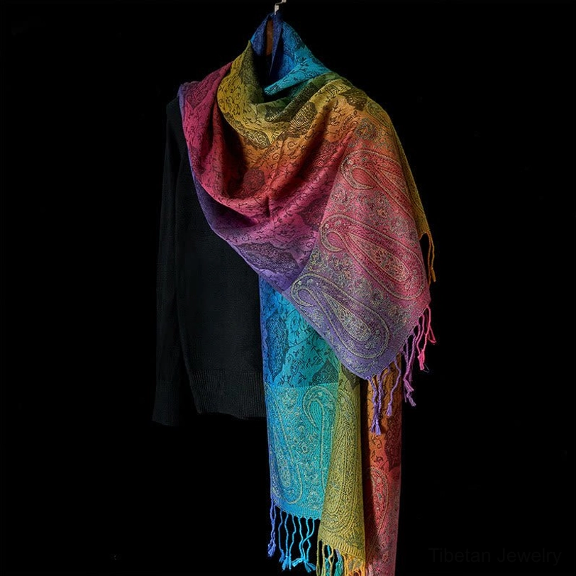 Tibetan rainbow paisley gradient tassel shawl color display - handcrafted textile with vibrant woven pattern