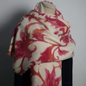 Tibetan red damask floral shawl displayed on mannequin showing three-quarter view of cream and red print