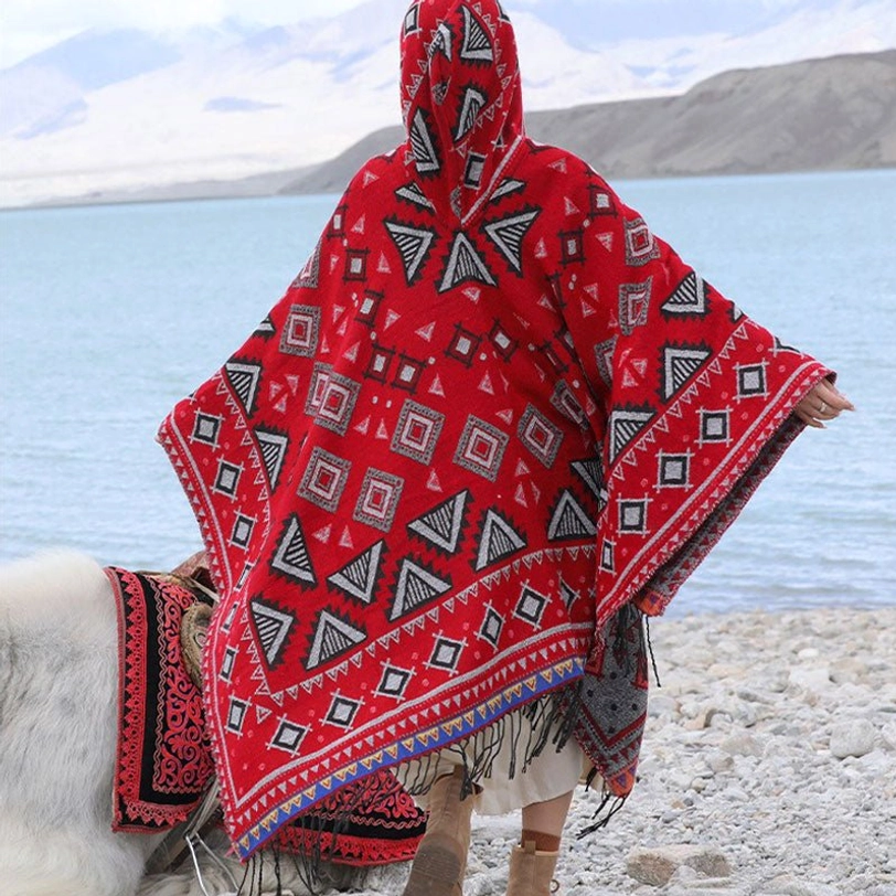 Red Tibetan hooded poncho cloak with tribal geometric prints and fringed hem, rear view