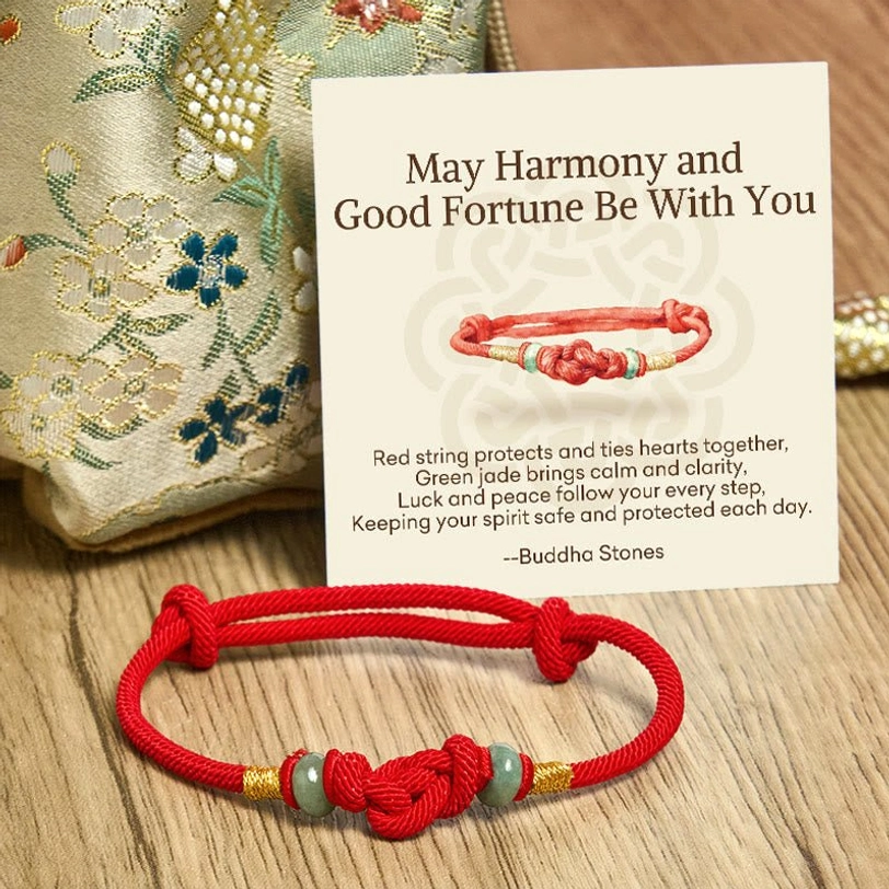 Hand-braided red string jade blessing bracelet with compact knot design featuring jade and decorative gold accents