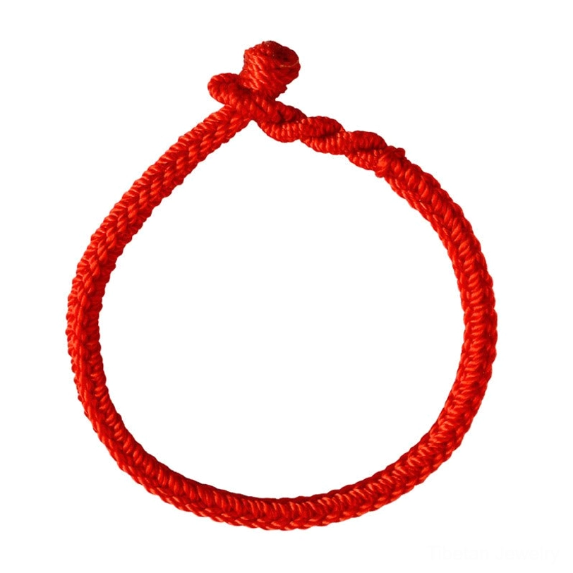 Red tibetan eight-thread peace knot blessing bracelet front flat lay showing neat woven rope texture and knot closure