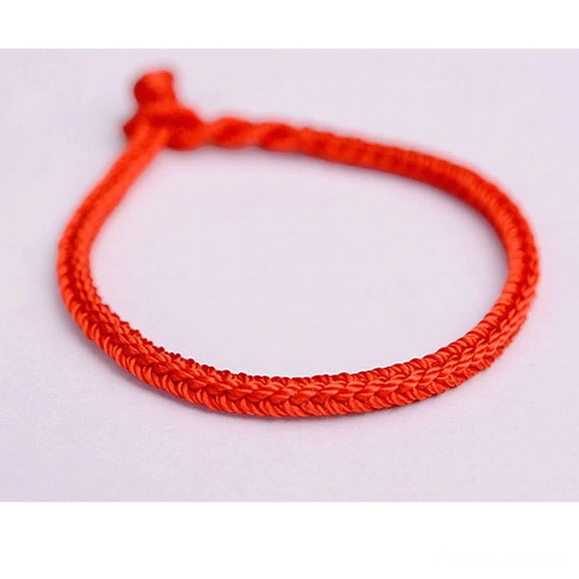 Red tibetan peace knot bracelet front flat view on white background with smooth woven finish and adjustable knot