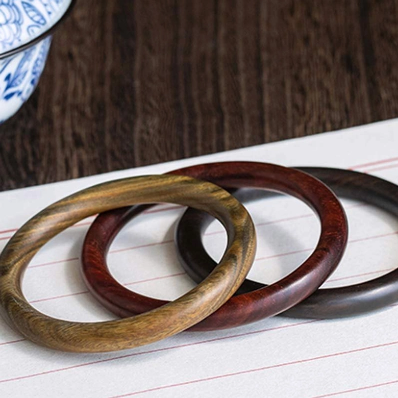 Handcrafted Tibetan red sandalwood protection bracelet with polished finish and natural wood characteristics