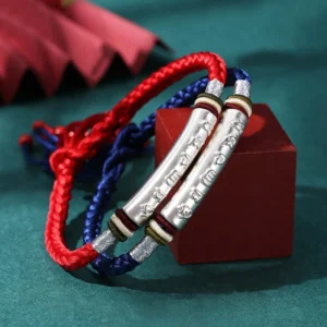 Two mixed color Tibetan Buddhist mantra bracelets with silver tubes and colorful braided ropes displayed together