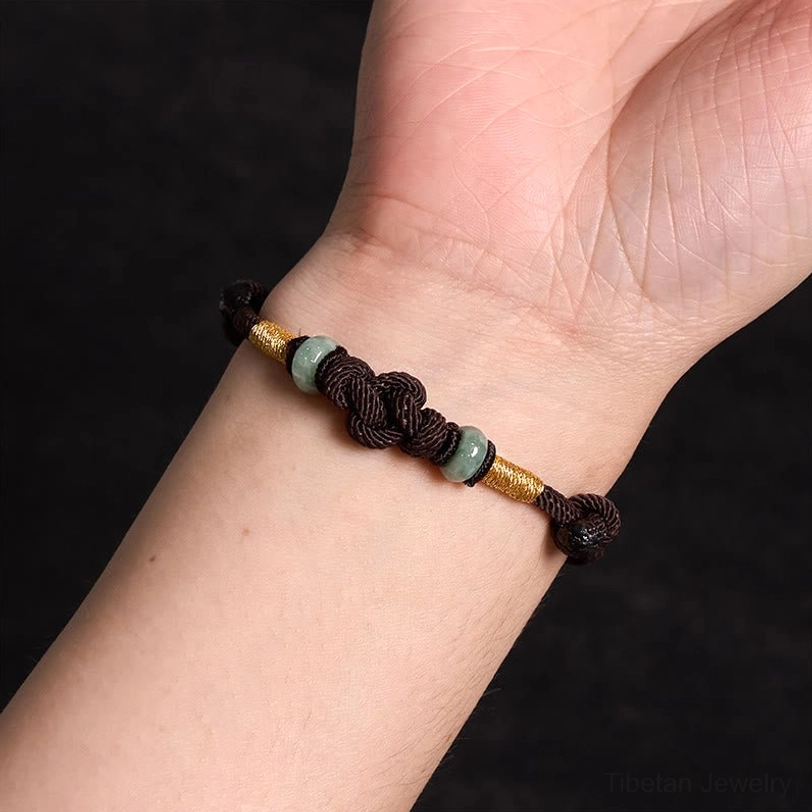 Tibetan couple bracelet with red string and jade showing romantic gift presentation idea