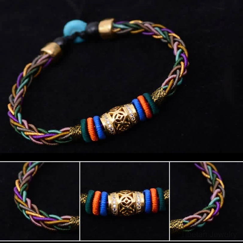 Handmade Tibetan eight knot bracelet with multicolor braid, gold turquoise and black beads, and engraved metal charm on dark background