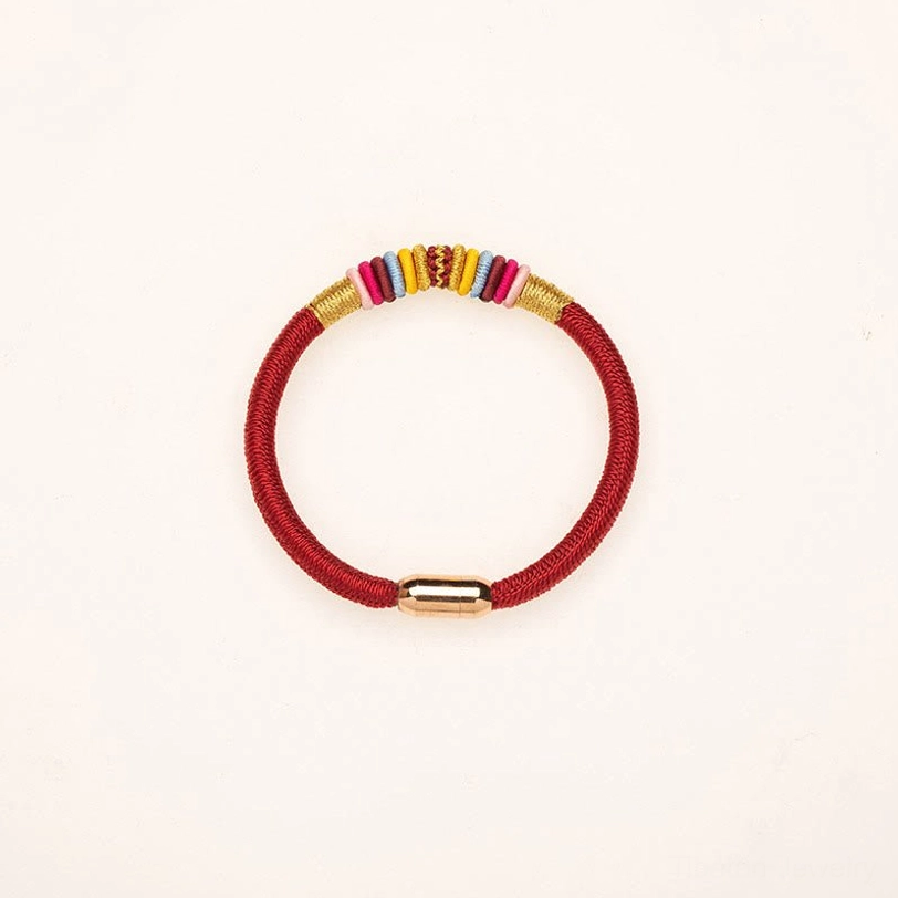 Handcrafted red Tibetan protection bracelet featuring Vajra Knot symbol and premium magnetic clasp