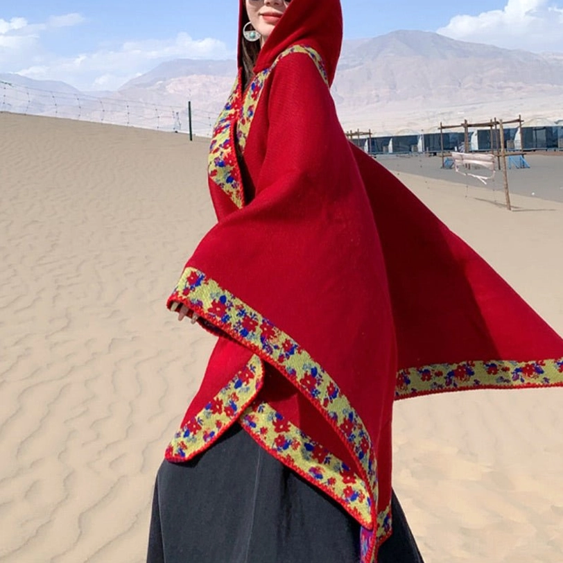 Tibetan reversible cloak showing both burnt orange and grey color options in flat lay presentation