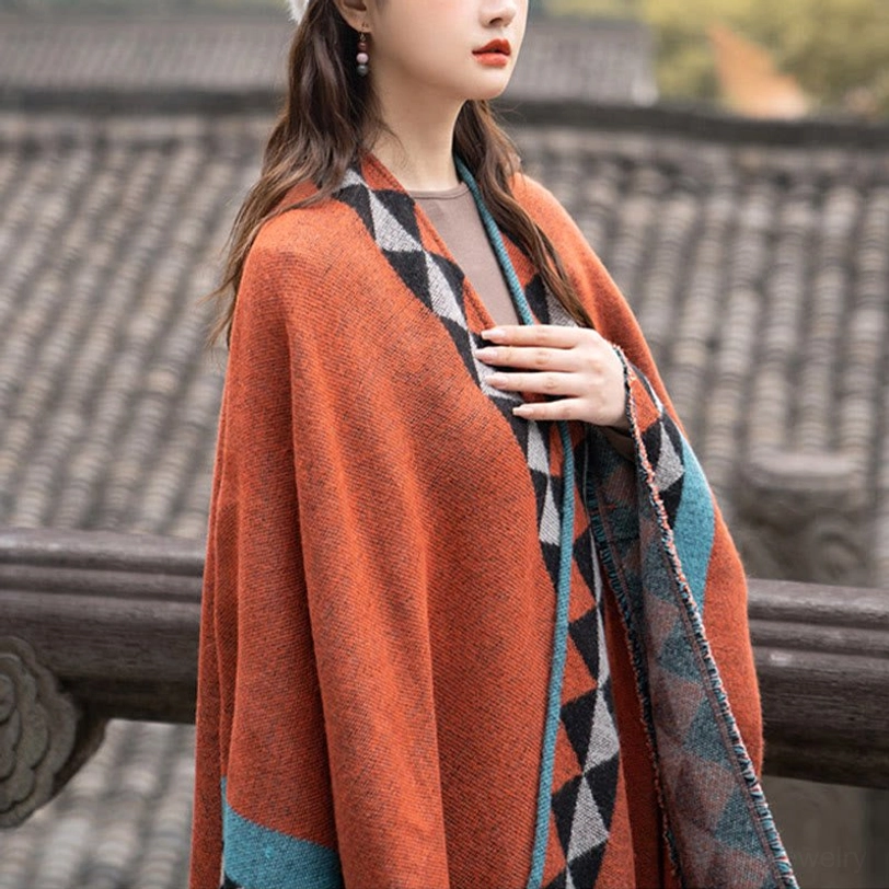 Full view of reversible Tibetan geometric shawl showing both patterned sides and complete tassel hem construction
