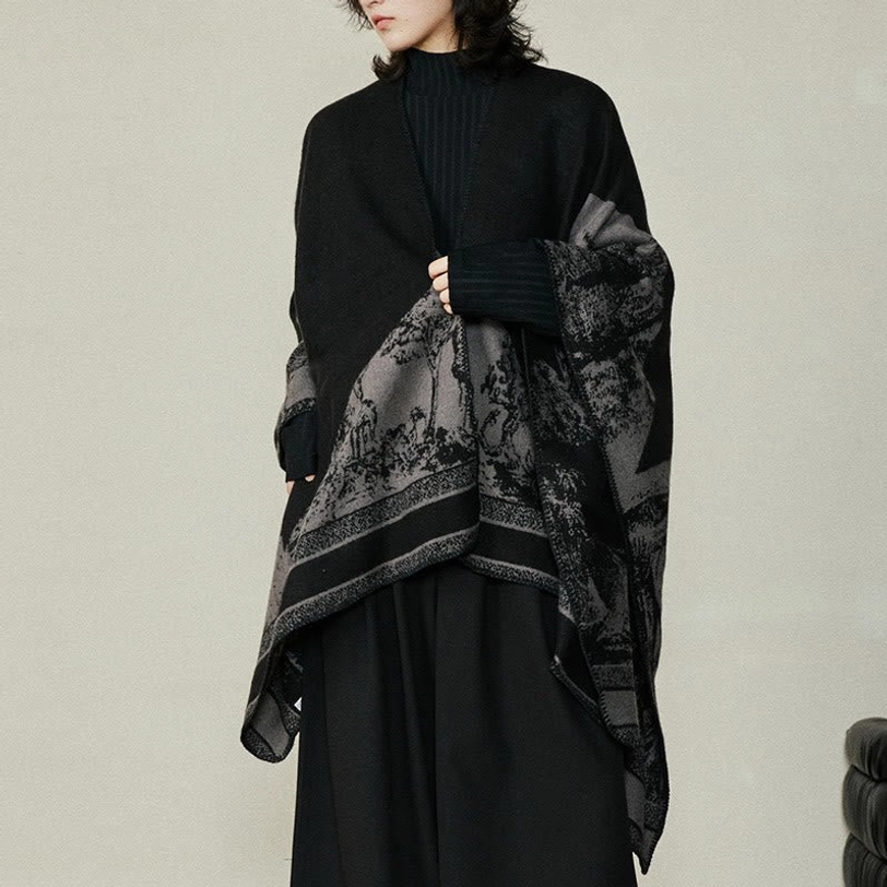Reversible Tibetan shawl showing forest animal pattern in natural studio lighting