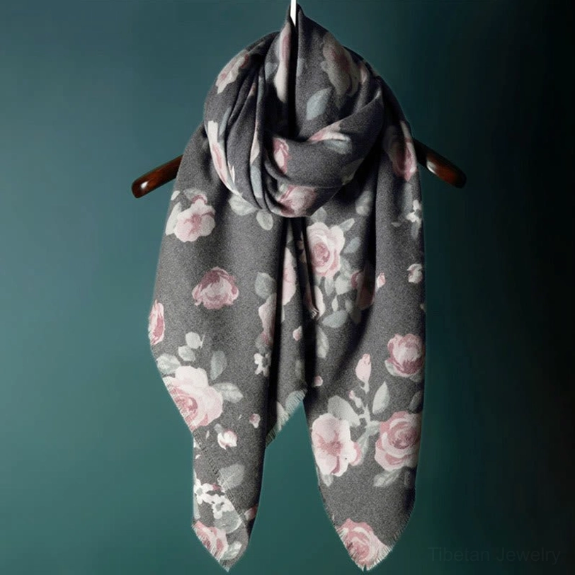 Tibetan rose shawl draped on chair showing bohemian aesthetic and authentic craftsmanship detail