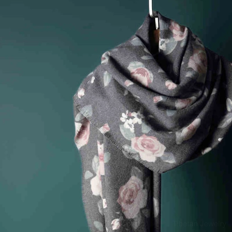 Tibetan rose shawl close-up showing raw frayed edges and authentic artisanal finish details