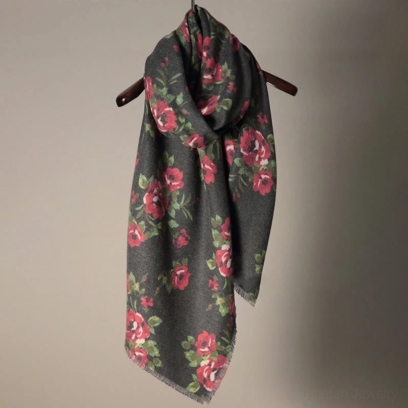 Tibetan rose floral printed shawl hanging on display, showing rich floral pattern and soft draped texture