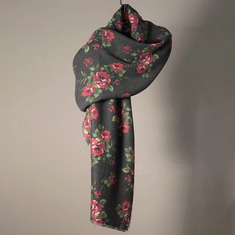 Single Tibetan rose floral wrap hanging on display wall with loose natural drape and textured hem