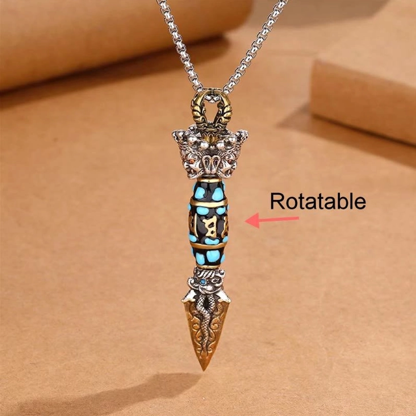 Rotatable Tibetan Dzi Bead Pendant Necklace direct top view with rotation indicator, showing the unique 360-degree rotating mechanism and detailed vajra ornament
