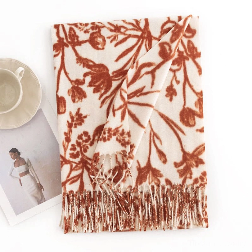 Tibetan rust red floral shawl wrap with cream background, flat lay showcasing detailed flower branch prints and tassel trim