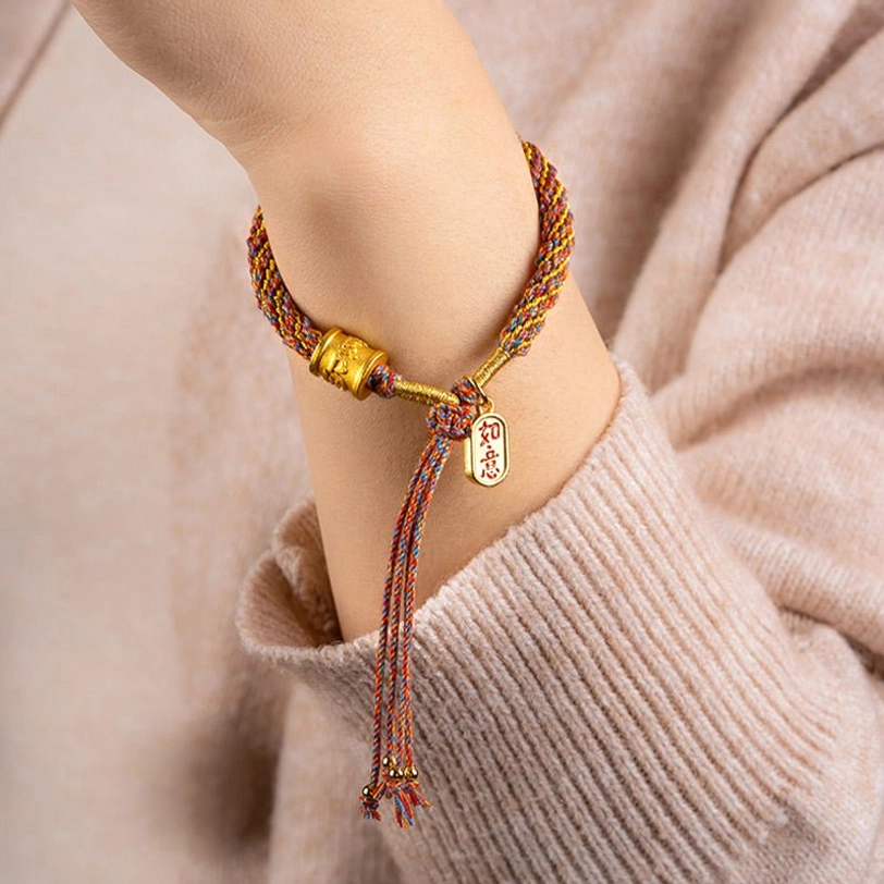 Tibetan Buddhist mantra bracelet worn on wrist with gold Ruyi auspicious charm side view