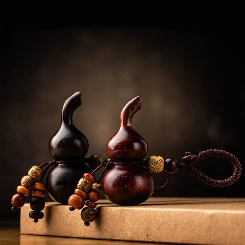 Sacred tibetan gourd keychain carved from premium red sandalwood and ebony wood, spiritual wellness accessory for daily positive intention and protection