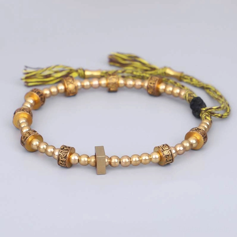Om Mani Padme Hum protection bracelet with cross-shaped metal ornament and yellow-brown braided cord
