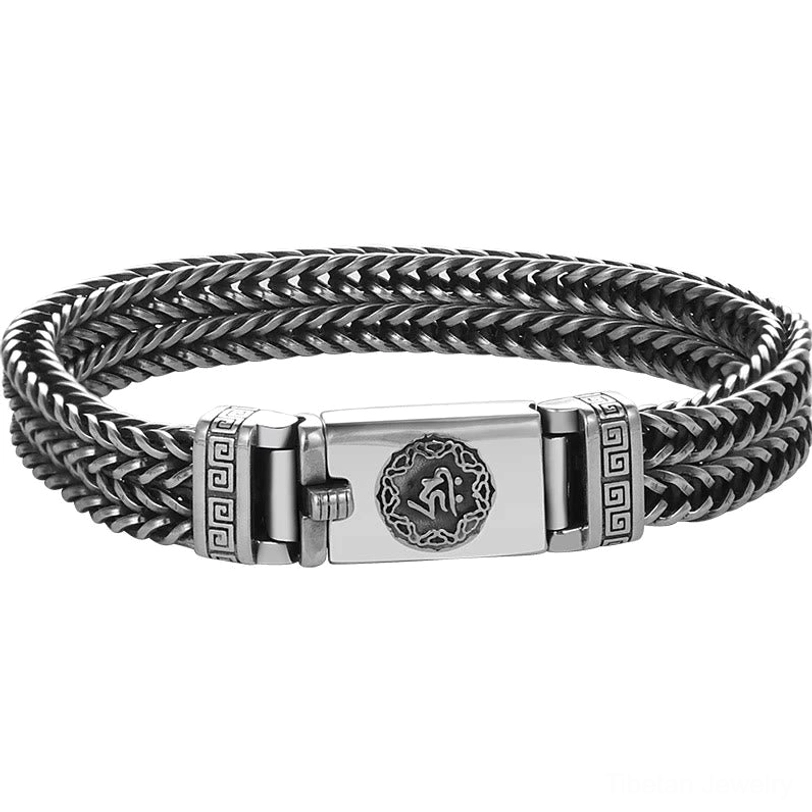 Full circular Om Mani Padme Hum braided bracelet with carved mantra buckle displayed flat against black background