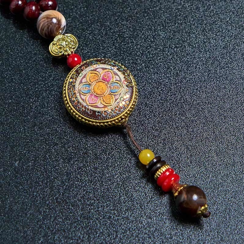 Tibetan spiritual necklace with sacred mantra pendant and natural wood bead strand