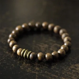 Tibetan sandalwood protection bracelet with natural wooden beads and bronze spacer rings, handcrafted meditation jewelry for healing and spiritual protection