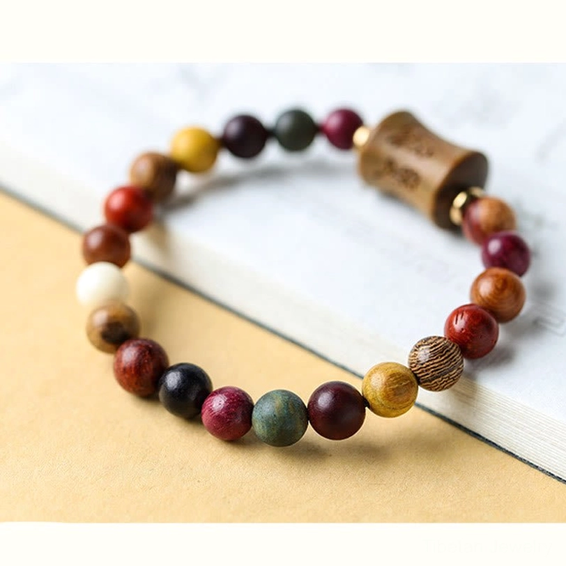 Tibetan Om Mani Padme Hum sandalwood bracelet size reference guide showing 8mm bead dimensions on measuring scale