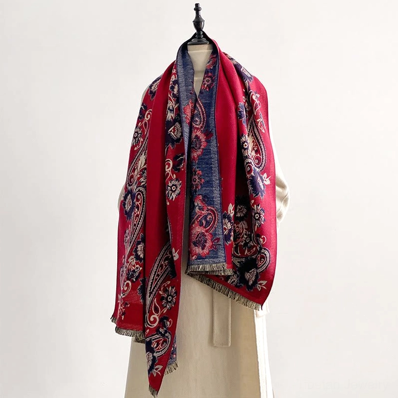 Burgundy and navy floral Tibetan scarf with dual-tone paisley motifs, dressed mannequin showcase with fully draped styling and fringe hem
