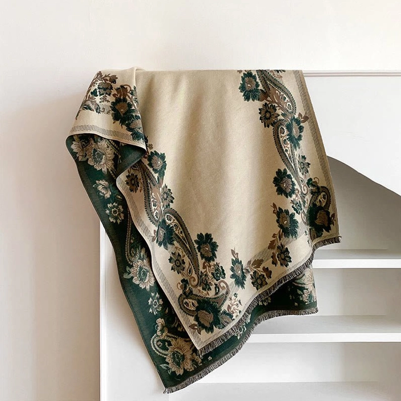 Cornsilk Tibetan reversible scarf with subtle paisley floral patterns, flat lay shelf display showing warm neutral tone and soft woven fabric