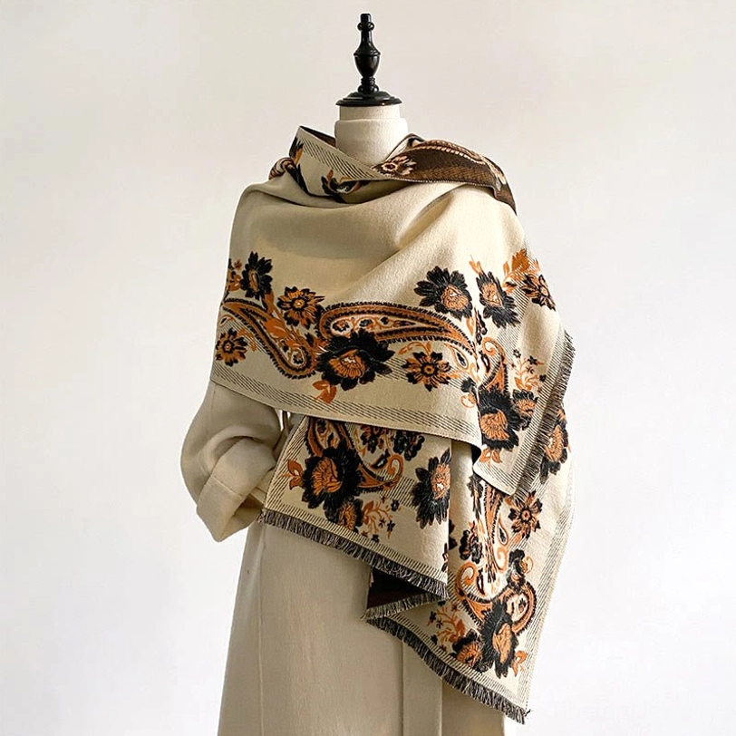 Tibetan reversible scarf featuring dual-tone paisley and floral patterns, close detail view showing jacquard weave texture and color richness