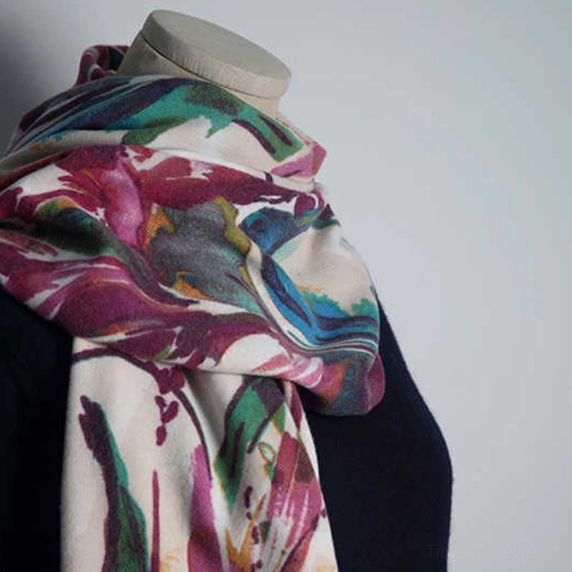 Close-up detail of Tibetan shawl showing crisp watercolor flower print and fine fabric weave